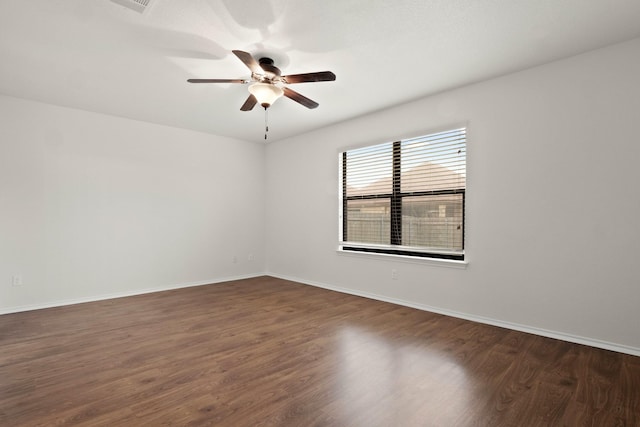 unfurnished room featuring dark hardwood / wood-style floors and ceiling fan