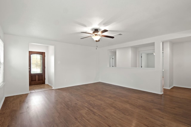 empty room with hardwood / wood-style flooring and ceiling fan