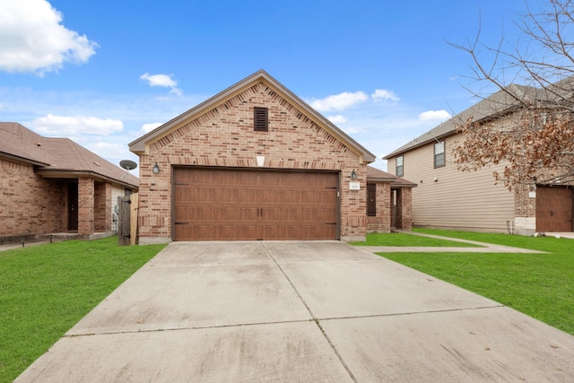 view of front of house with a garage and a front yard