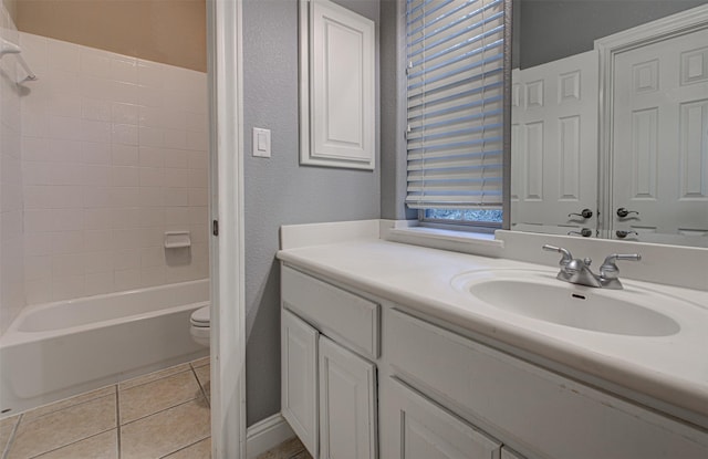 full bathroom with tile patterned floors, toilet, bathing tub / shower combination, and vanity