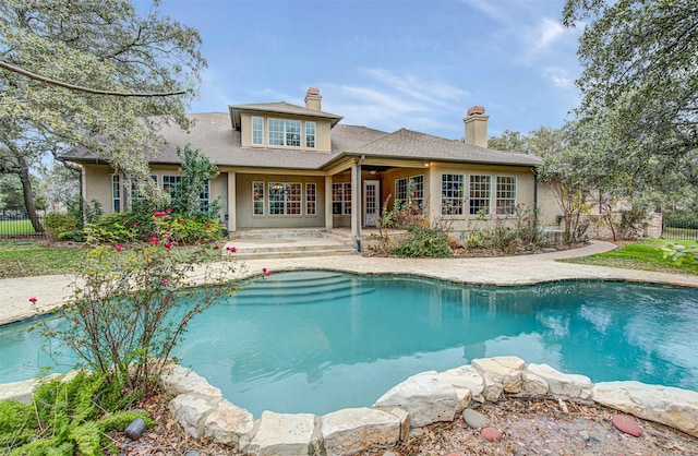 view of swimming pool with a patio