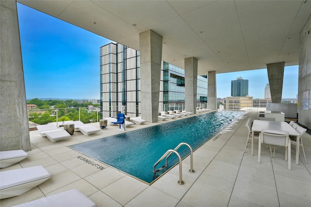 view of swimming pool with a patio