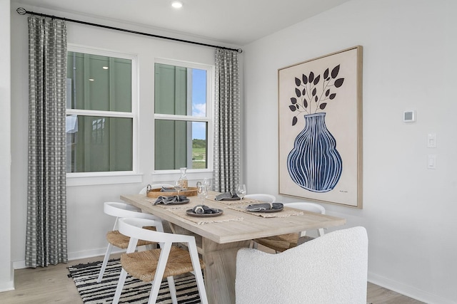 dining area with hardwood / wood-style flooring