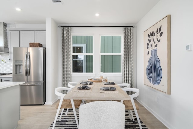 dining room featuring light wood-type flooring