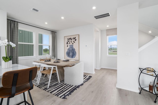 dining space featuring light hardwood / wood-style flooring