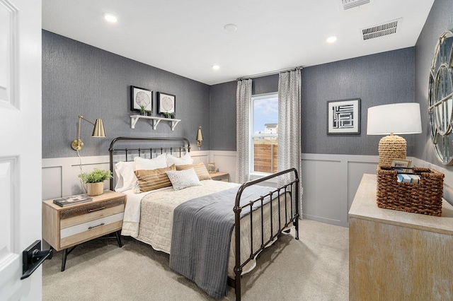 bedroom with light colored carpet