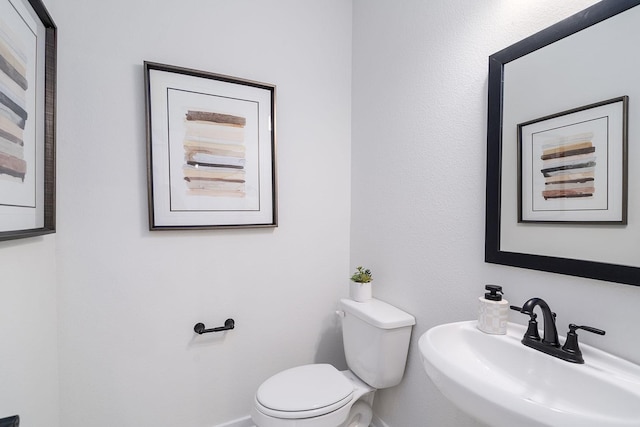 bathroom with sink and toilet