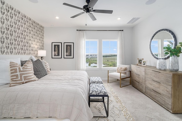 carpeted bedroom with ceiling fan