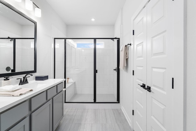 bathroom with vanity and walk in shower