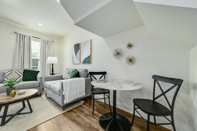 living room with baseboards and wood finished floors