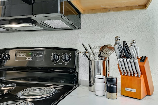 room details featuring black range with electric cooktop