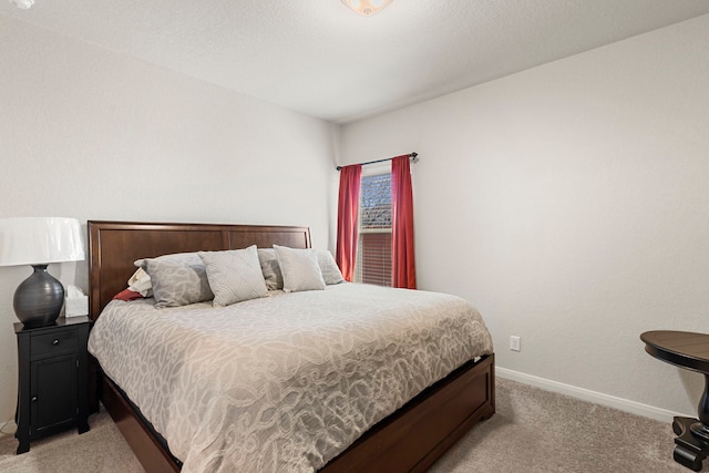 bedroom with light carpet