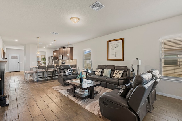 living room with a textured ceiling