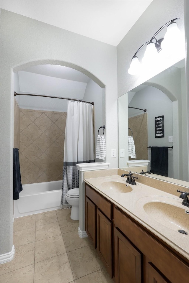 full bathroom with vanity, tile patterned floors, shower / bath combination with curtain, and toilet