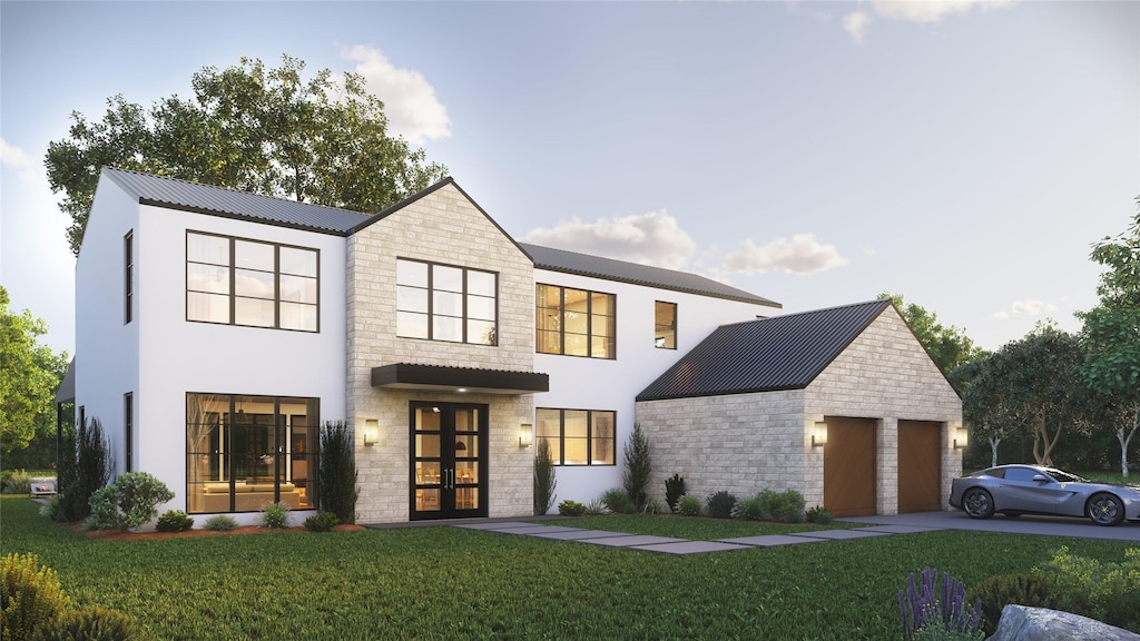 view of front of home featuring french doors, a garage, and a front yard