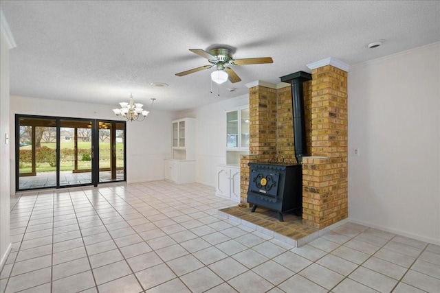 unfurnished living room featuring light tile patterned floors, ornamental molding, and a wood stove