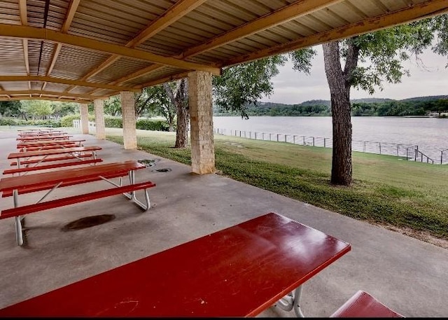 view of patio with a water view