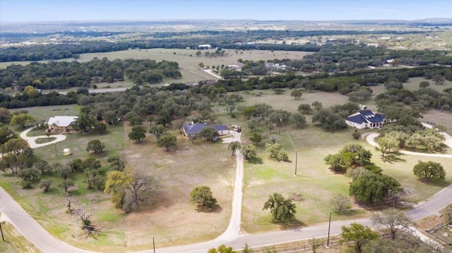 birds eye view of property featuring a rural view