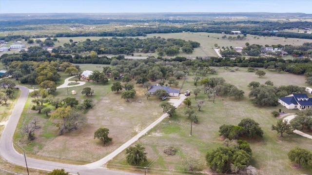 birds eye view of property featuring a rural view