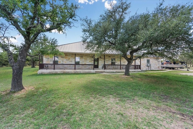 exterior space featuring a front lawn and a porch