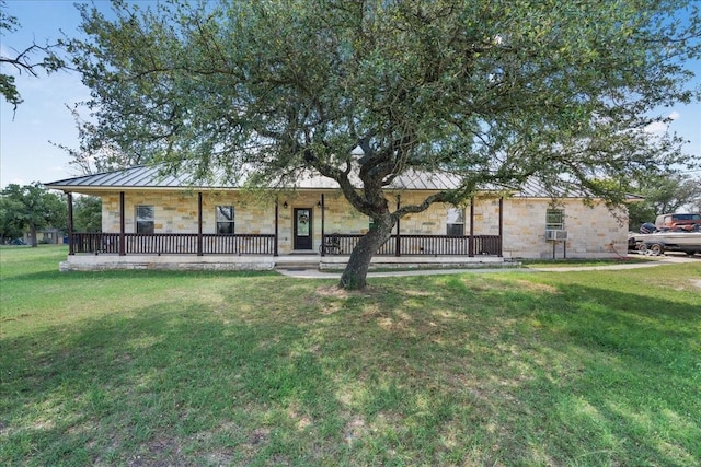 ranch-style house featuring a front lawn and covered porch