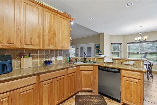 kitchen featuring sink, tasteful backsplash, stainless steel dishwasher, kitchen peninsula, and pendant lighting