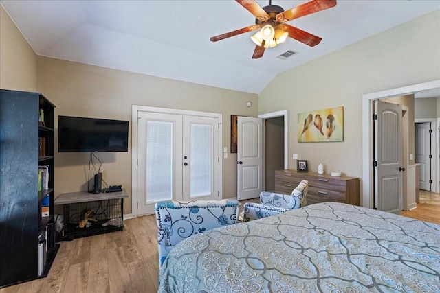 bedroom with lofted ceiling, light hardwood / wood-style floors, french doors, and ceiling fan