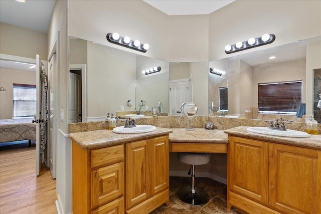 bathroom with vanity and wood-type flooring