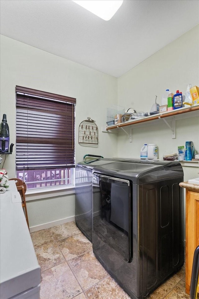 laundry area with separate washer and dryer