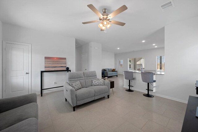 305 Ravens Crest Dr, Hutto, TX 78634 - living area featuring a ceiling fan, recessed lighting, light tile patterned floors, and baseboards