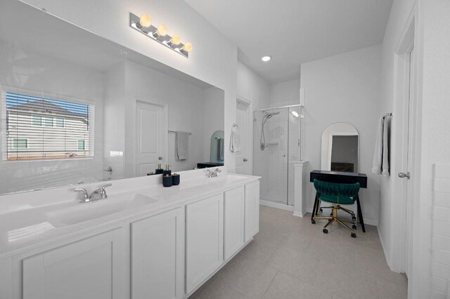 305 Ravens Crest Dr, Hutto, TX 78634 - bathroom featuring a stall shower, double vanity, tile patterned flooring, and recessed lighting
