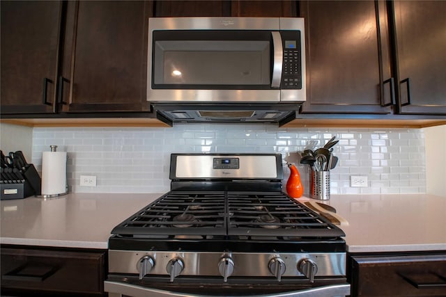 kitchen featuring decorative backsplash, dark brown cabinets, and stainless steel appliances