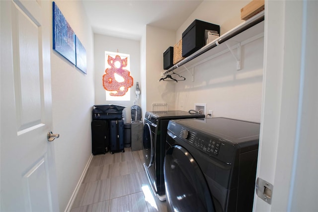 washroom with washing machine and dryer