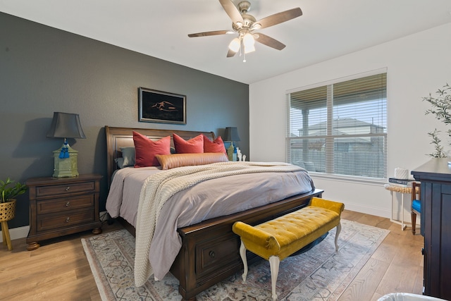 bedroom featuring light wood-type flooring and ceiling fan