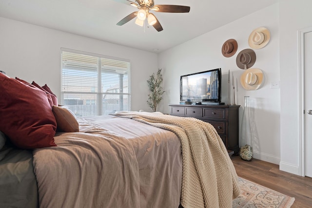 bedroom with ceiling fan and hardwood / wood-style floors