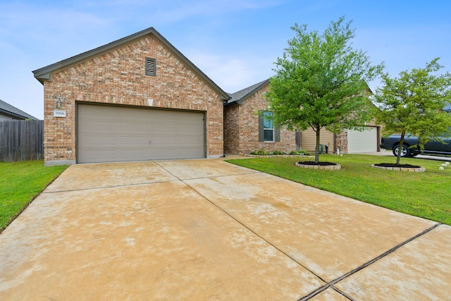 view of front of house with a garage and a front lawn