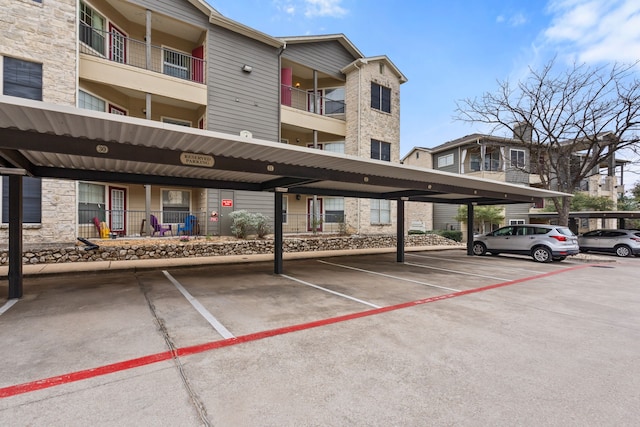 view of vehicle parking featuring a carport