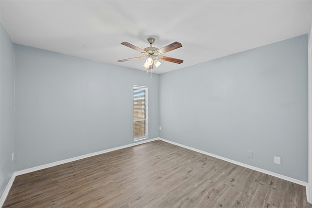 empty room featuring hardwood / wood-style flooring and ceiling fan