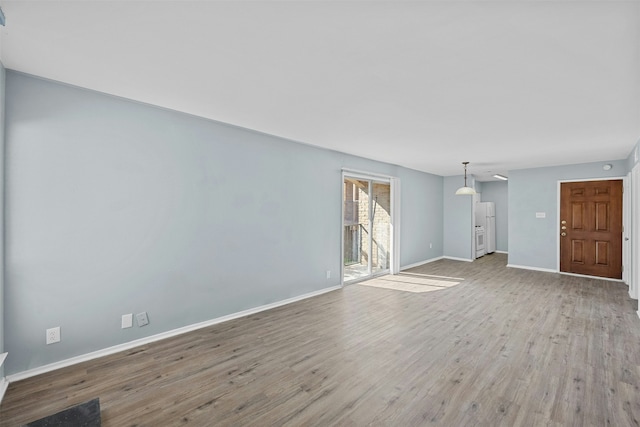 unfurnished living room featuring light hardwood / wood-style floors