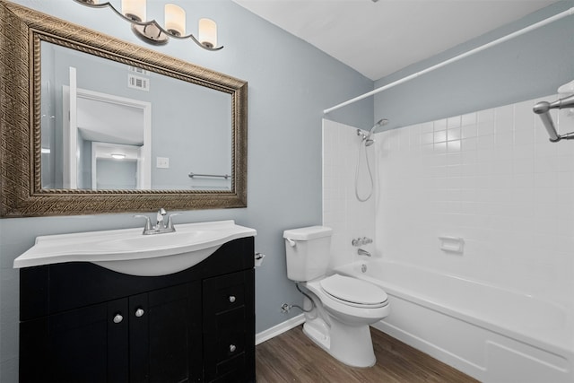 full bathroom featuring vanity, toilet, shower / bath combination, and hardwood / wood-style floors