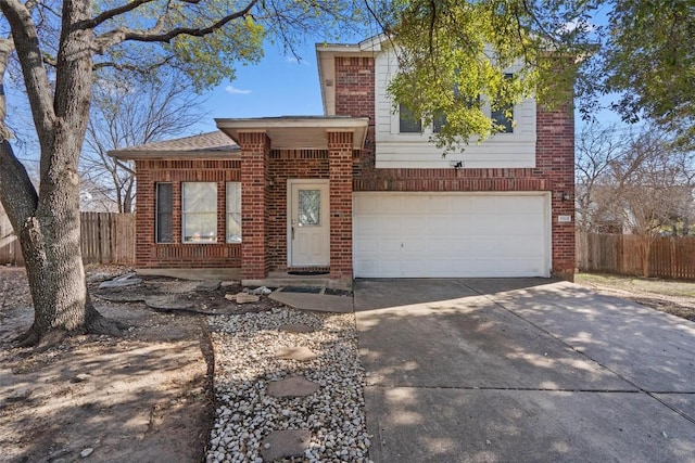 tri-level home featuring driveway, brick siding, an attached garage, and fence