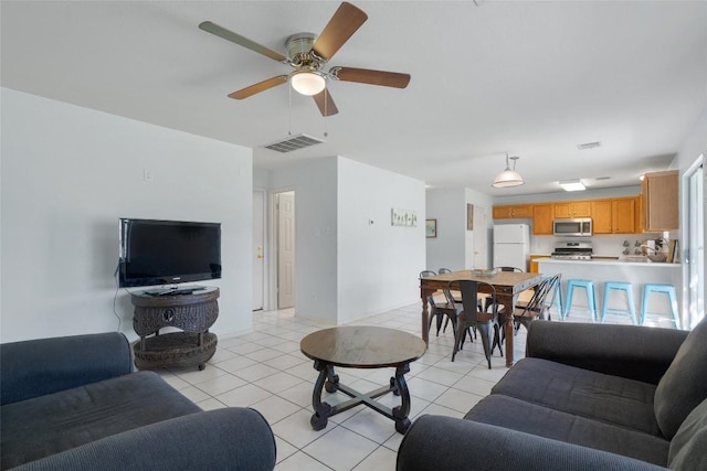 15101 Sweet Caddies Dr, Pflugerville, TX 78660 - living room featuring light tile patterned flooring and ceiling fan