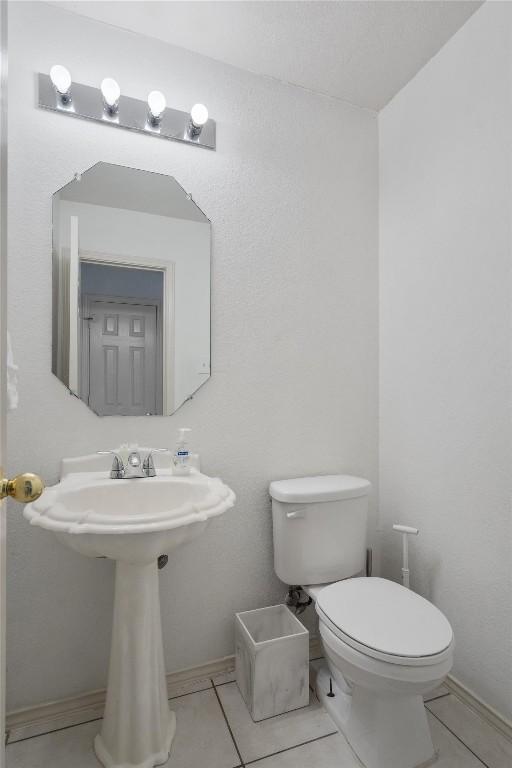 15101 Sweet Caddies Dr, Pflugerville, TX 78660 - half bathroom with toilet and tile patterned floors
