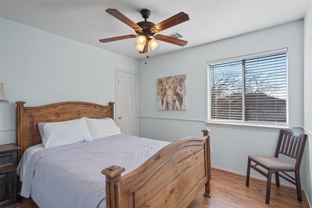 15101 Sweet Caddies Dr, Pflugerville, TX 78660 - bedroom with wood finished floors, baseboards, and a ceiling fan