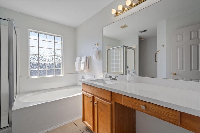 15101 Sweet Caddies Dr, Pflugerville, TX 78660 - full bathroom with a stall shower, a bath, vanity, and tile patterned flooring