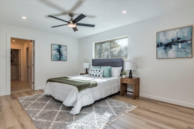 bedroom featuring ceiling fan and light hardwood / wood-style flooring