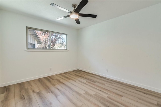 empty room featuring light hardwood / wood-style floors and ceiling fan