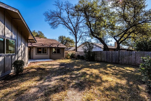 view of yard featuring a patio area and fence