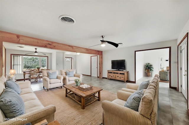 living room with beamed ceiling and ceiling fan