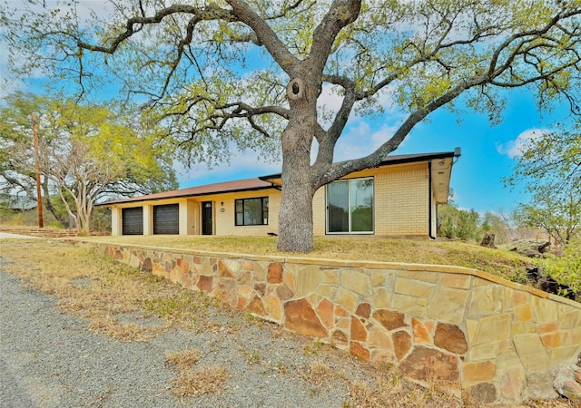 view of side of property with a garage